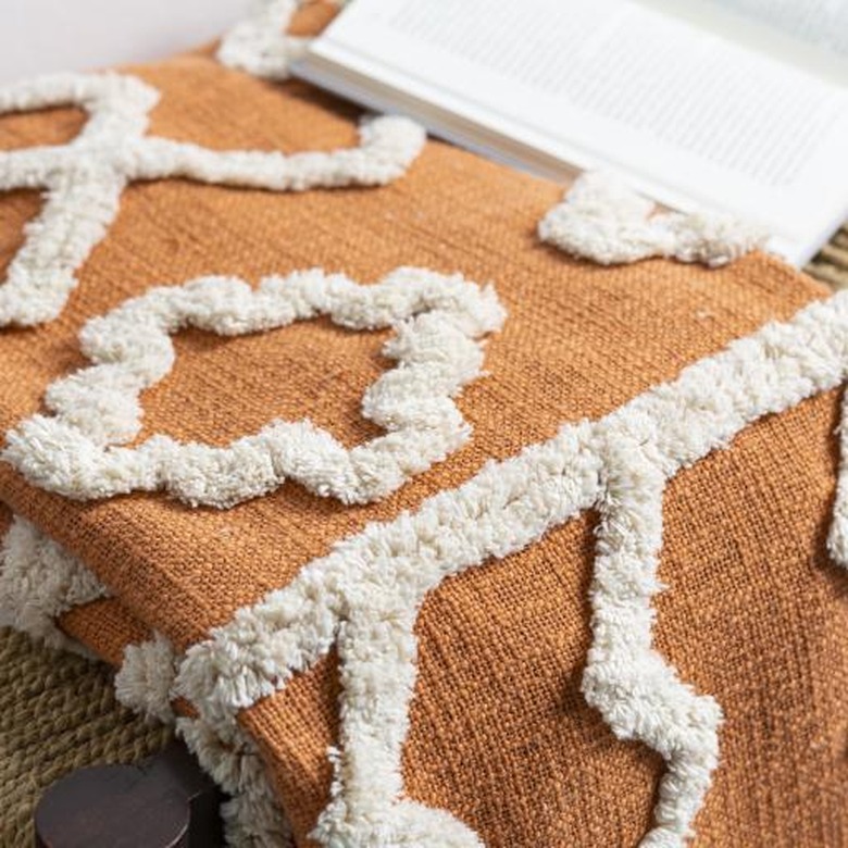 orange throw blanket with white pattern