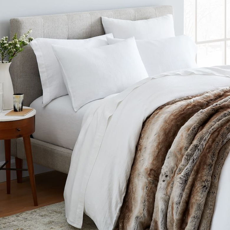 farmhouse bedding idea from West Elm with Belgian linen and faux fur