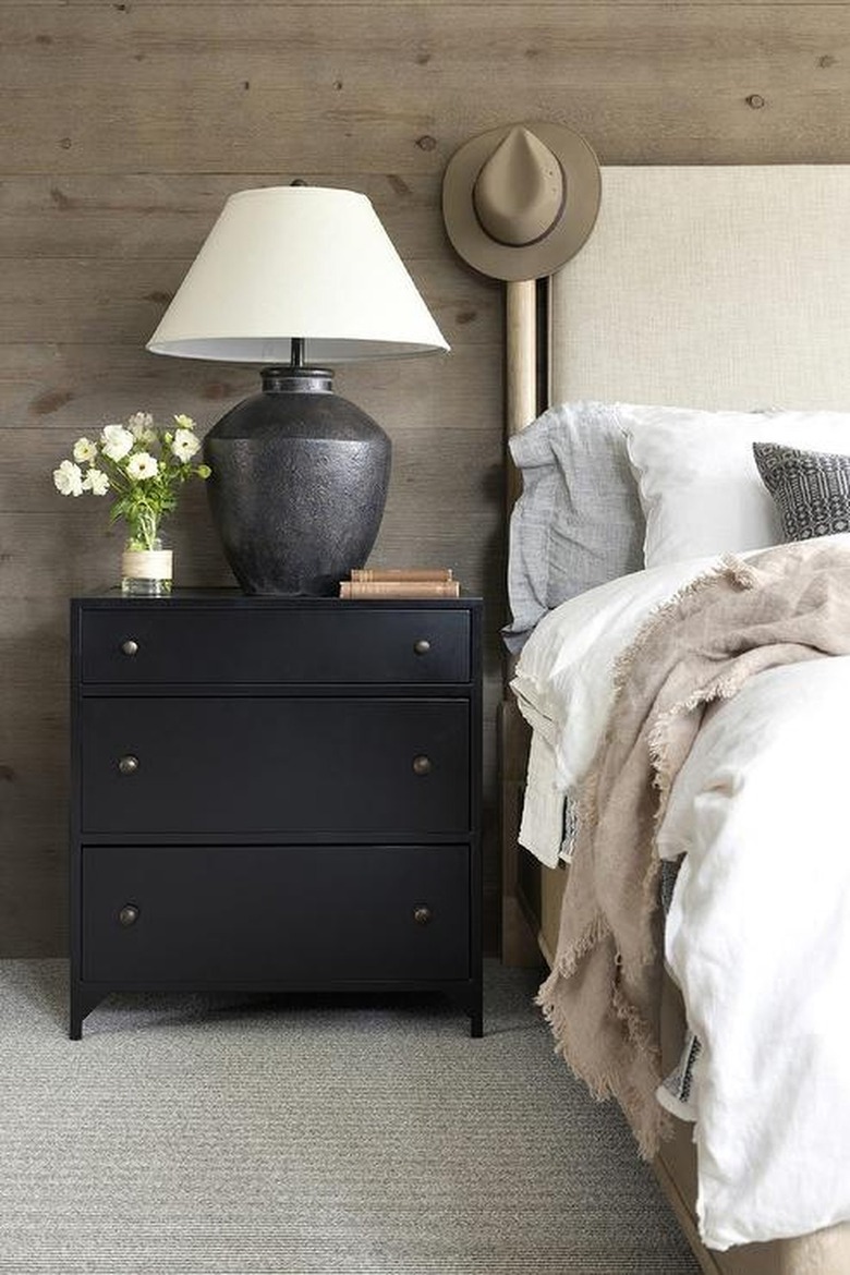 farmhouse bedroom with wood paneled wall