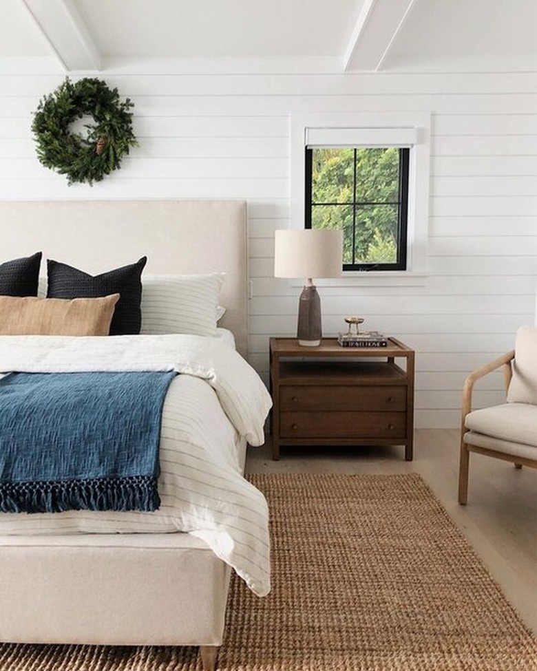 farmhouse bedroom decor with shiplap walls.