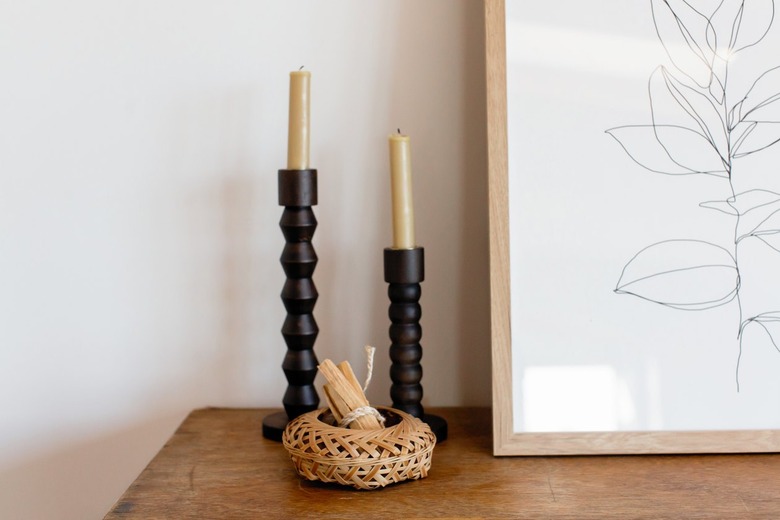 taper candles in carved candleholders for decoration