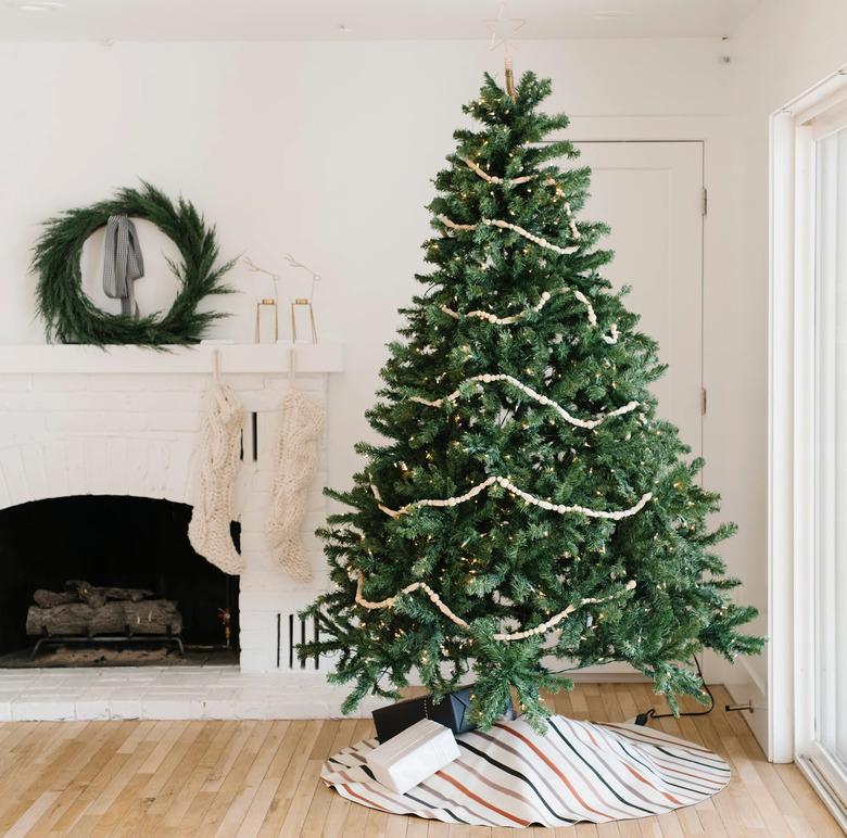 farmhouse Christmas decor with tree skirt in white farmhouse living room