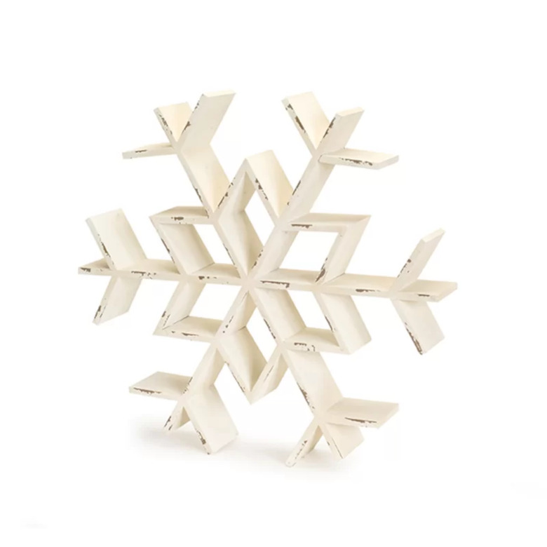 farmhouse Christmas decor with snowflake wall shelf with chipped paint in white