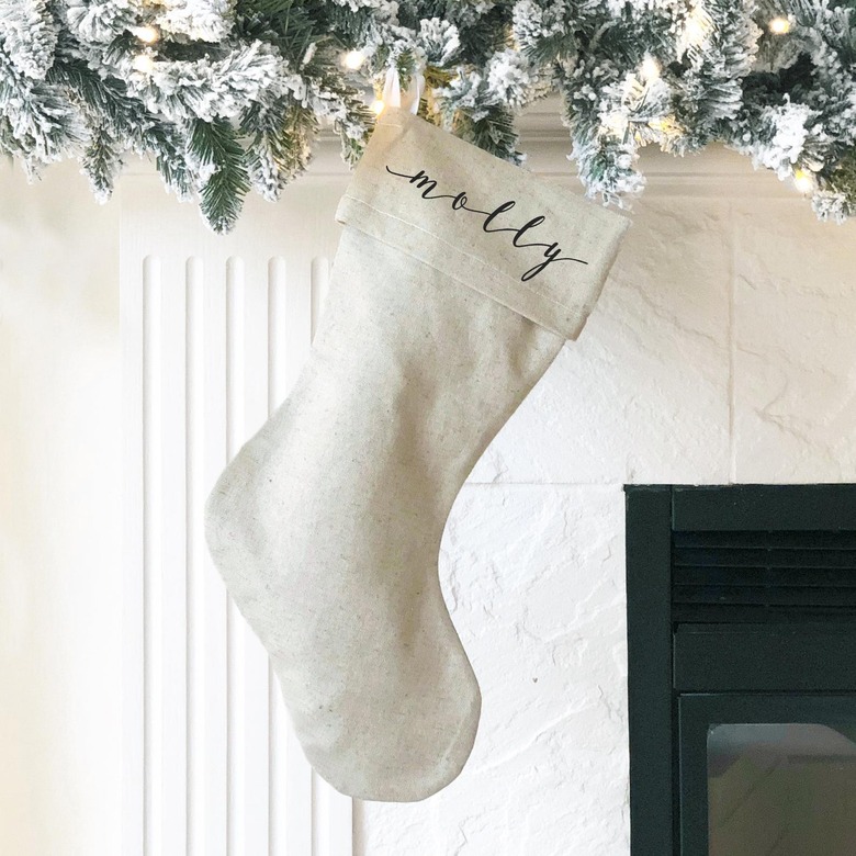 Customized farmhouse Christmas decor with stocking in burlap with script lettering