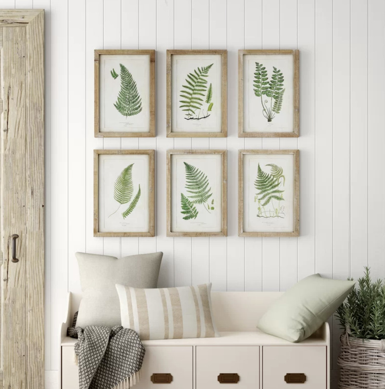 Birch Lane farmhouse decor in hallway with tongue and groove walls with botanical artwork