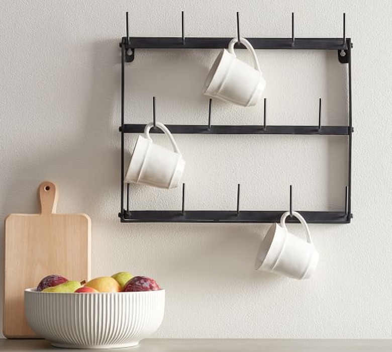 Pottery Barn farmhouse decor with iron mug rack and ceramic mugs