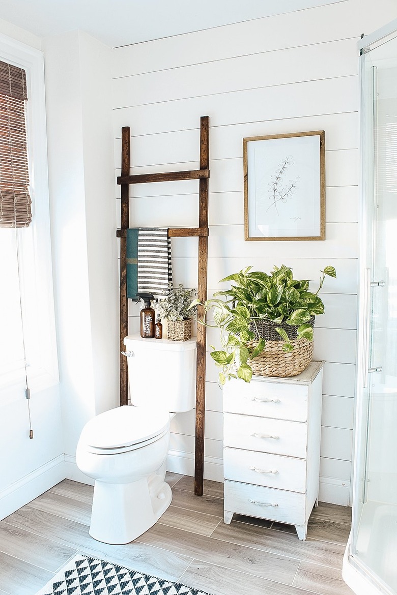 farmhouse DIY idea with wood bathroom ladder in white farmhouse bathroom