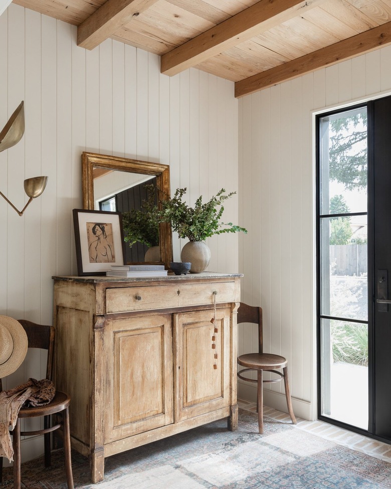 cabinet with distressed finish in farmhouse entryway