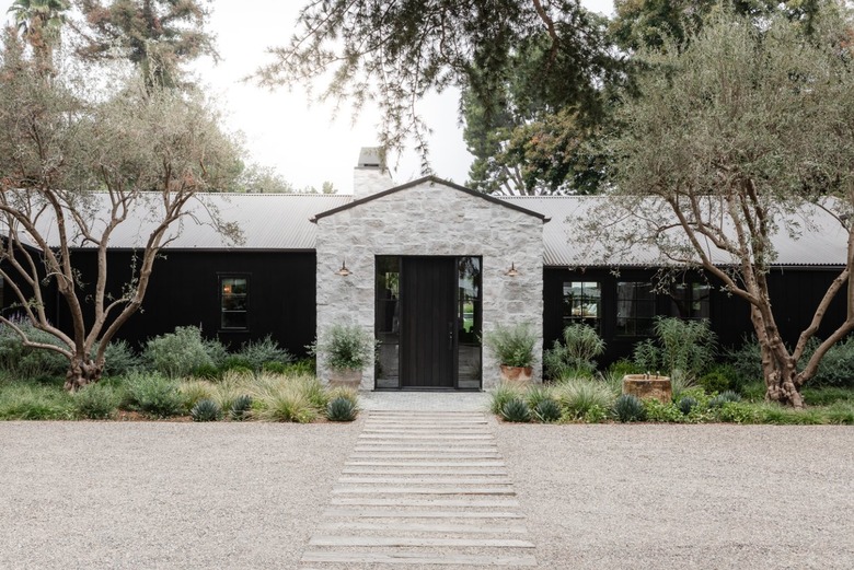 Modern farmhouse with stone entryway.