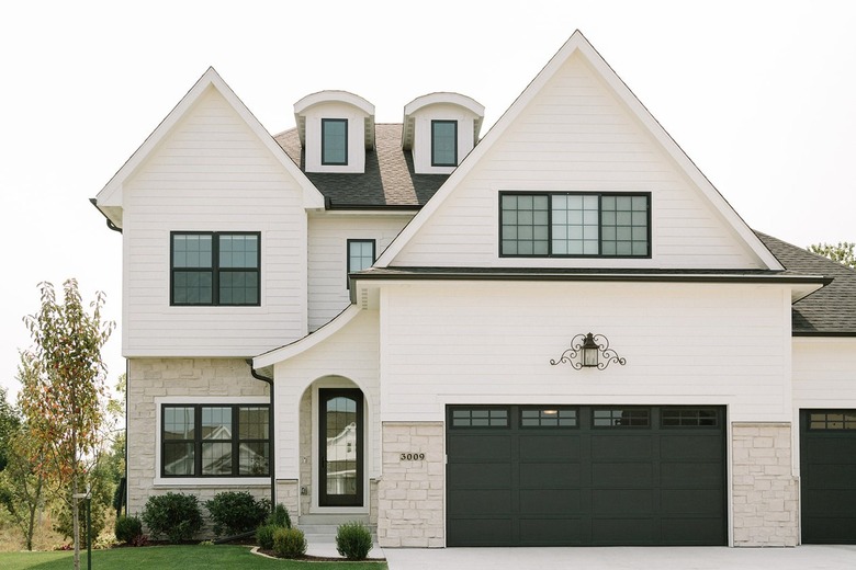 black and white exterior with black garage door