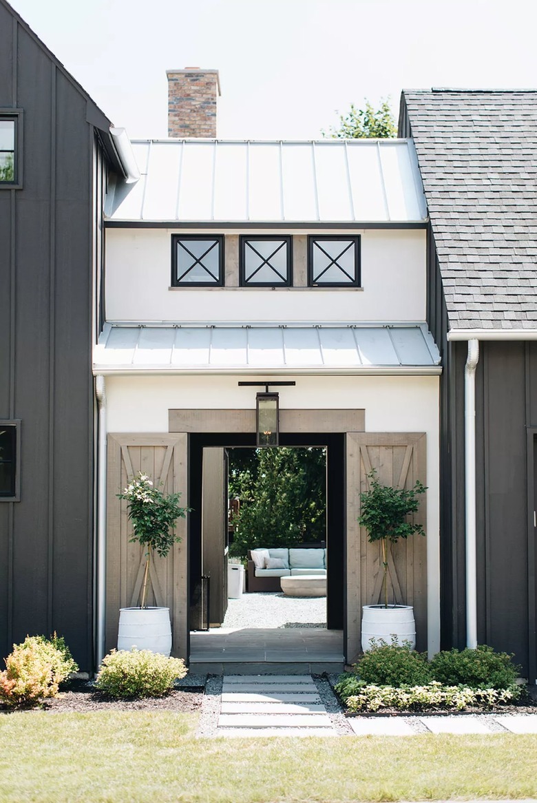 wood barn doors on farmhouse exterior