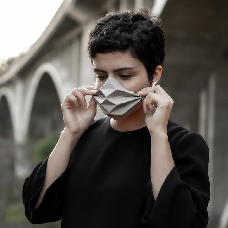 person wearing origami-style mask