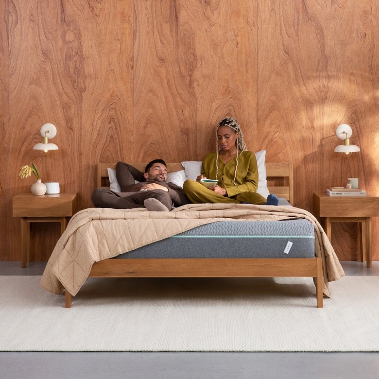 two people relaxing on mattress