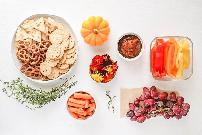 Ingredients for herbed cheese game day board