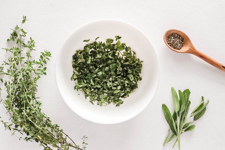 Mixing chopped herbs