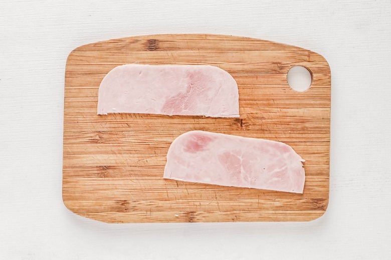 Cut two strips of deli meat