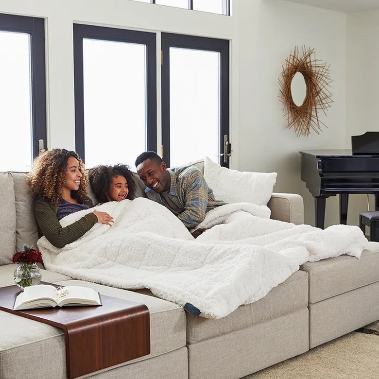 family on the couch in a lovesac blanket