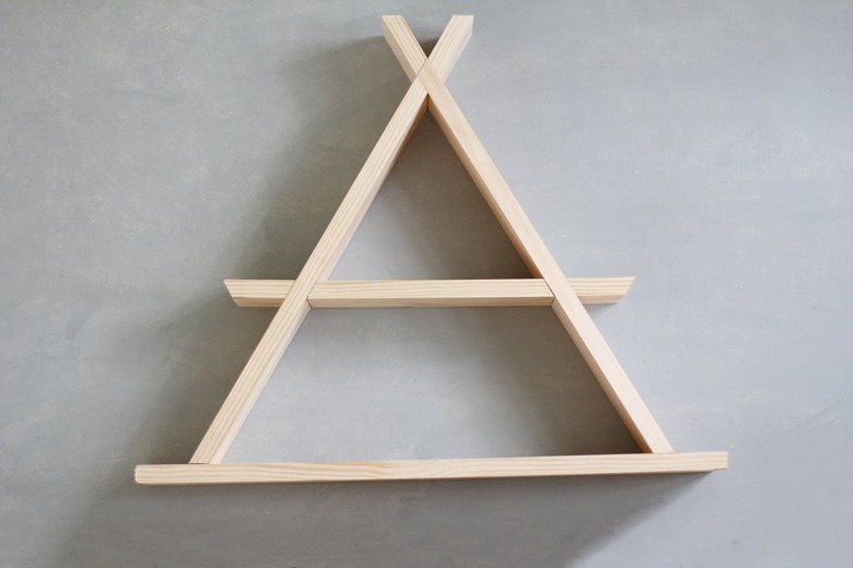 Wooden a-frame shelf against grey background