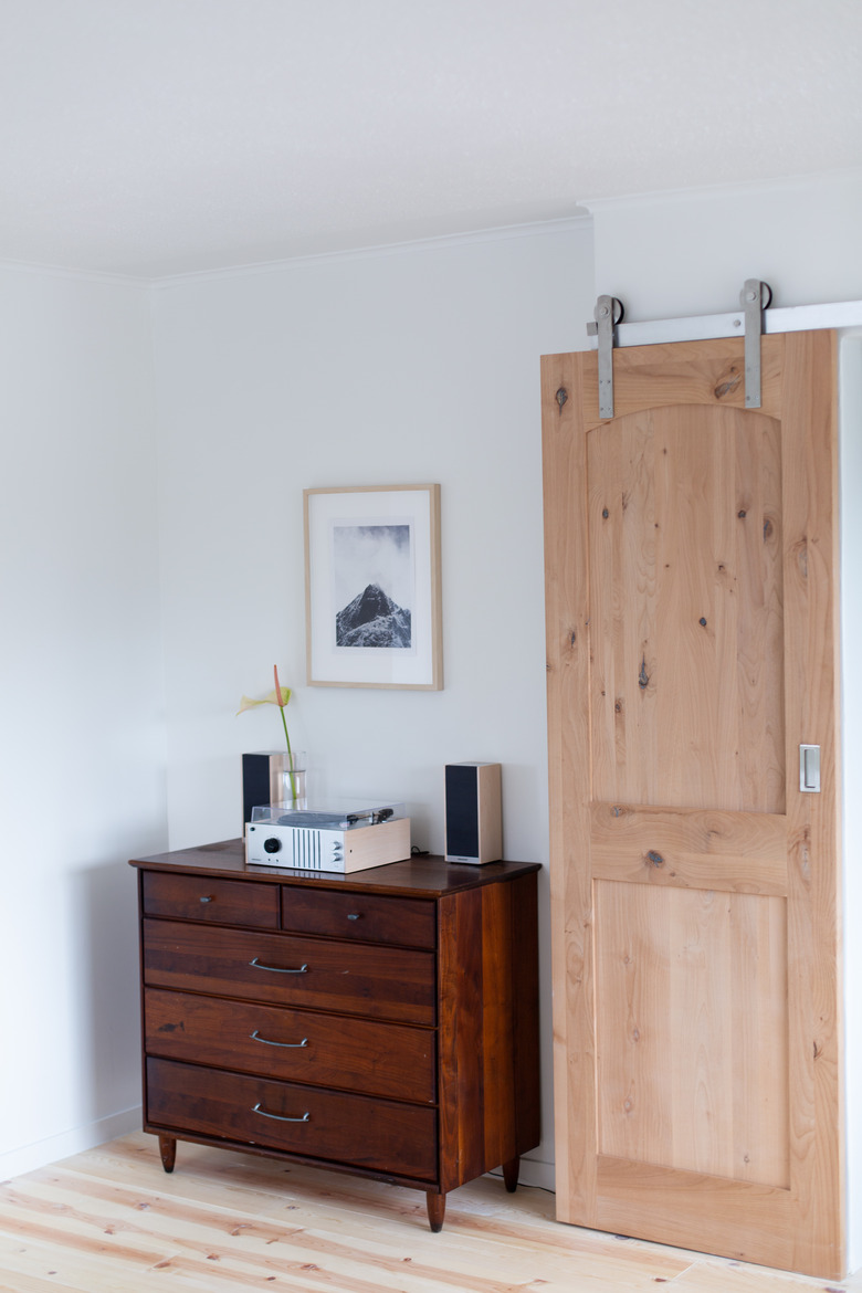 Vintage dresser and framed print from a trip to Norway personalize the studio.