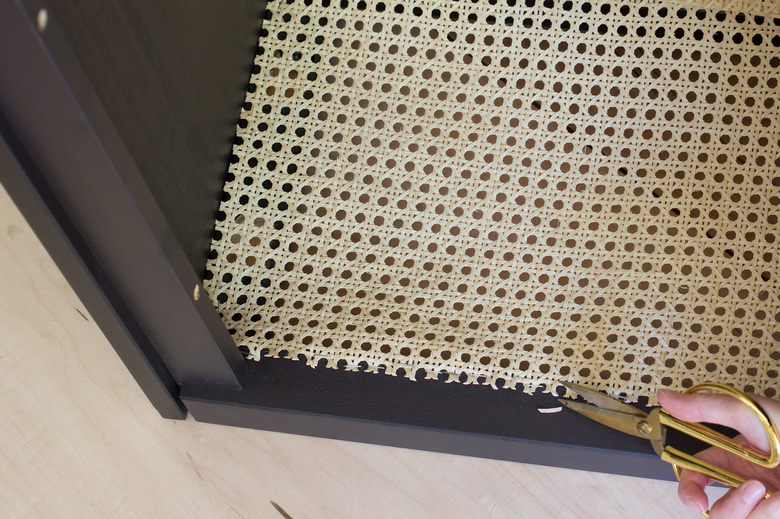 Trimming stray pieces of cane webbing