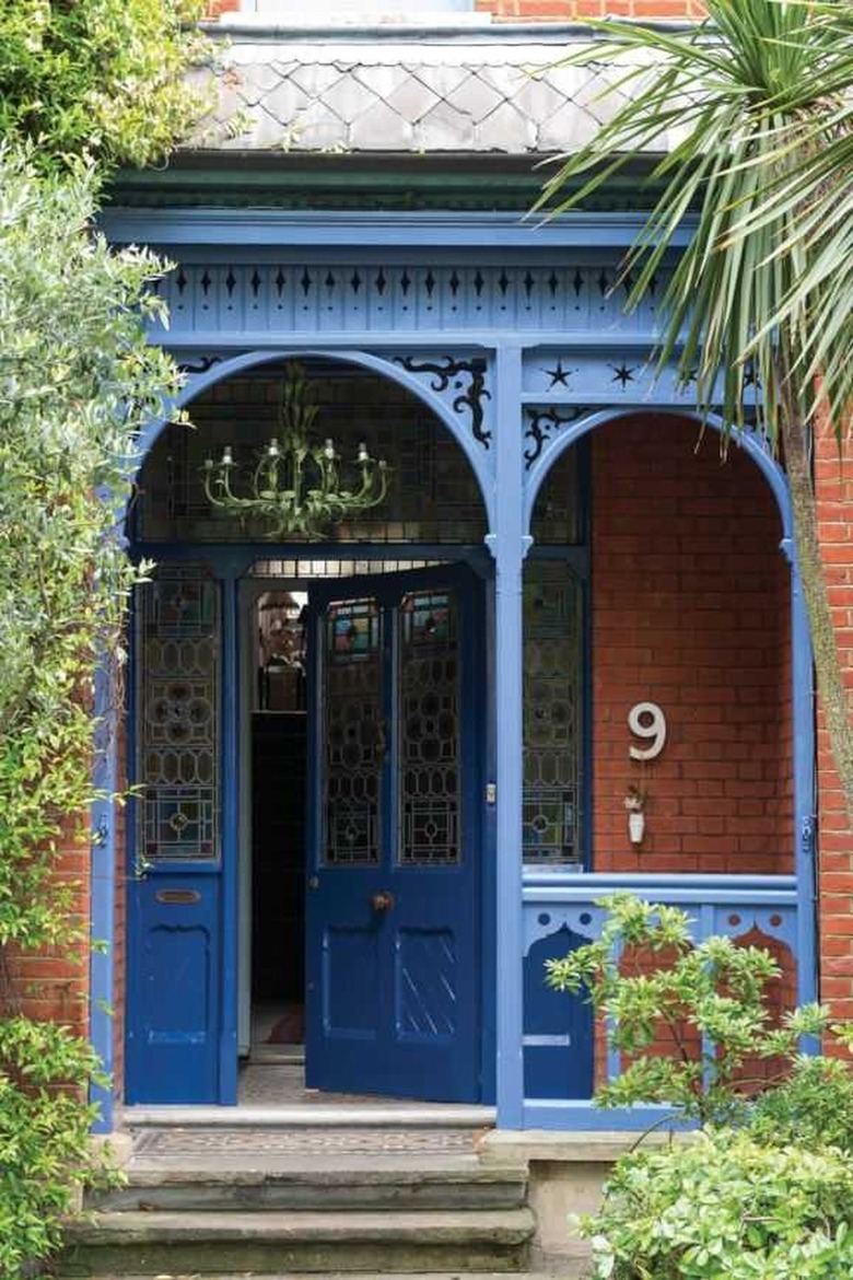 red brick exterior with blue front door