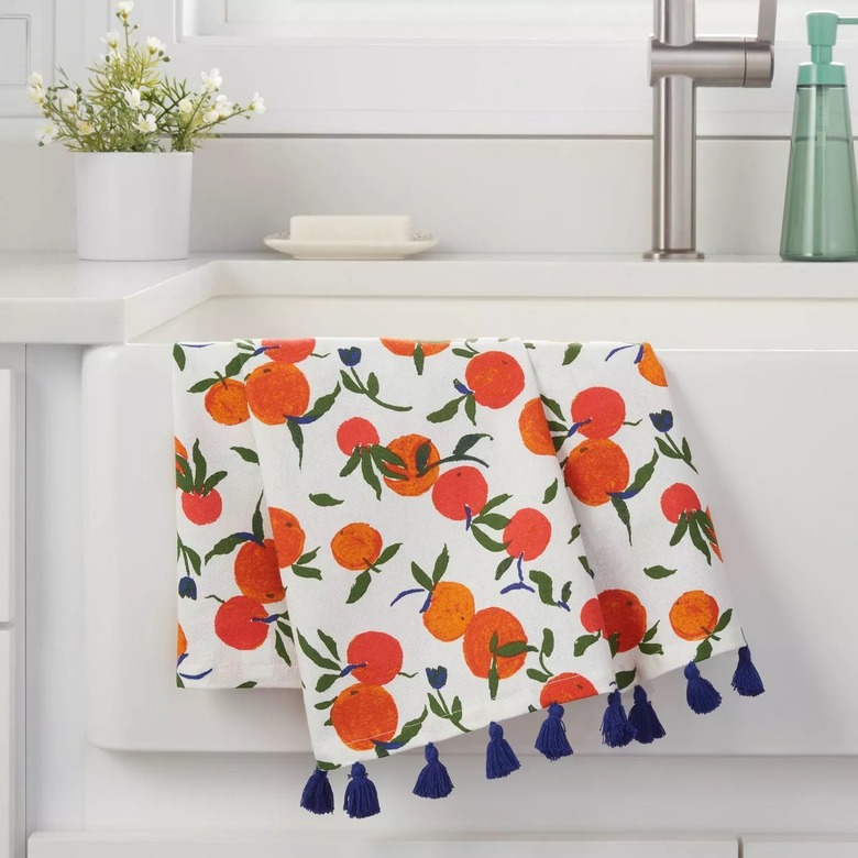 orange patterned towel with blue tassels