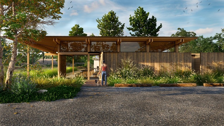 A landscape rendering depicting a person walking their dog toward a home surrounded by lush native plants