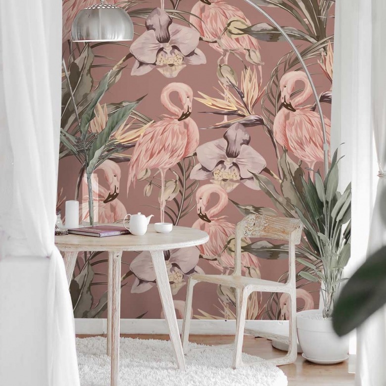 table and chair with flamingo wallpaper in the background