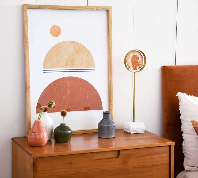 bedside table with painting