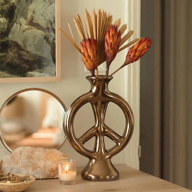 peace shaped bronze colored vase from jungalow