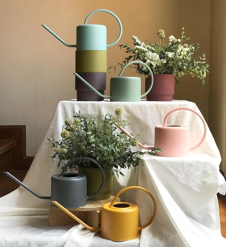 pastel colored gardening pitchers from etsy shop