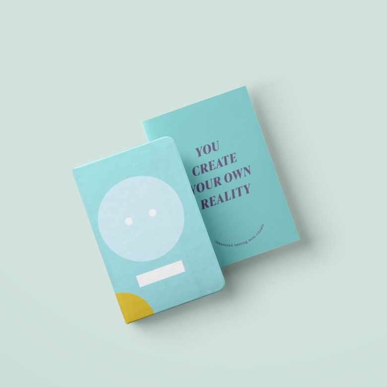 two notebooks on blue background