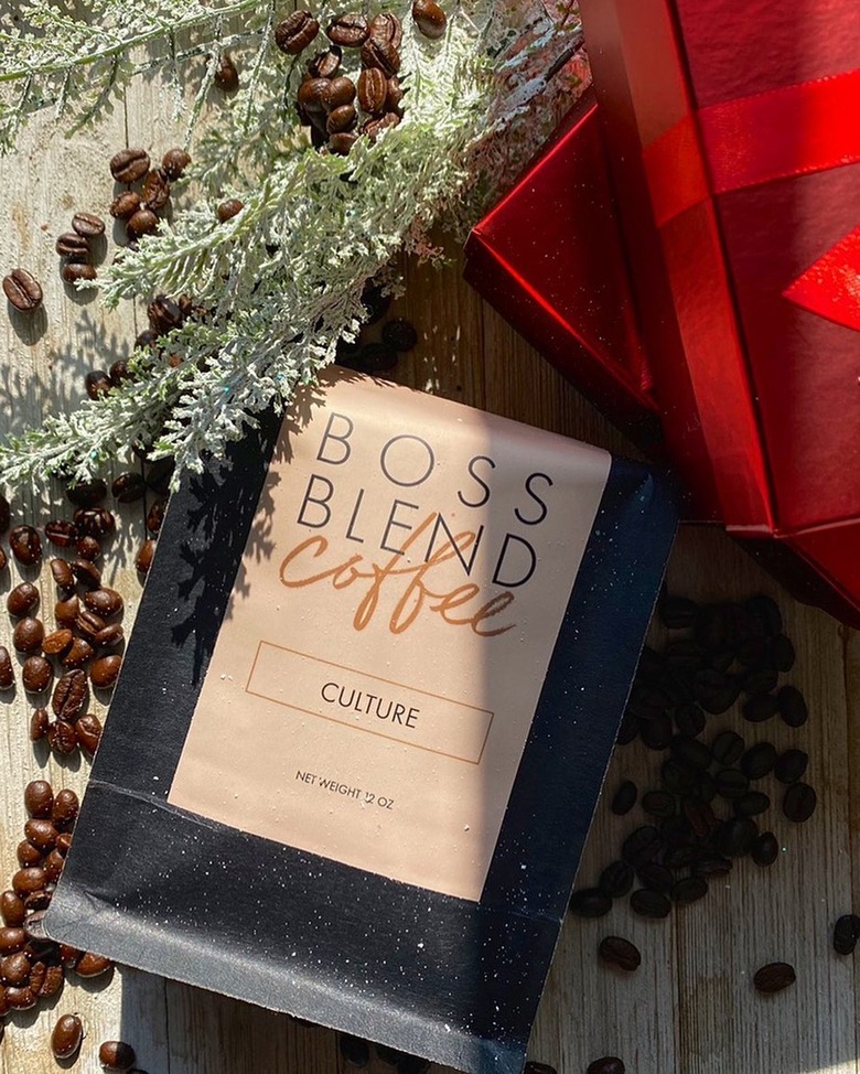 overhead photo of plant and wrapping paper and coffee bag with text that reads boss blend coffee culture