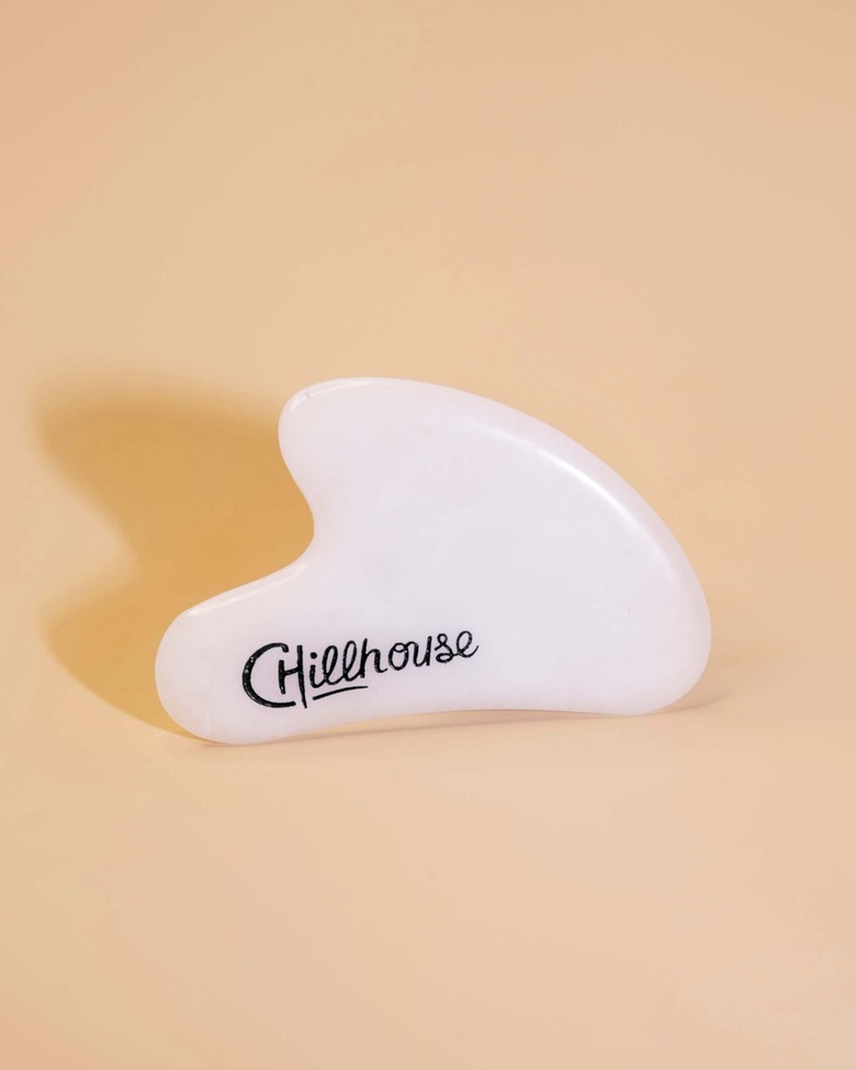 facial massage tool with chillhouse logo