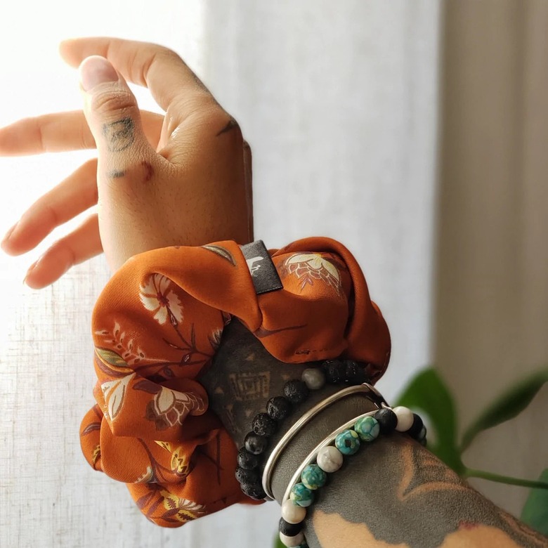 Tazzlyfe BREEZE scrunchie modeled on wrist.