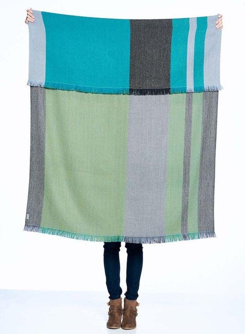 Throw blanket held by individual