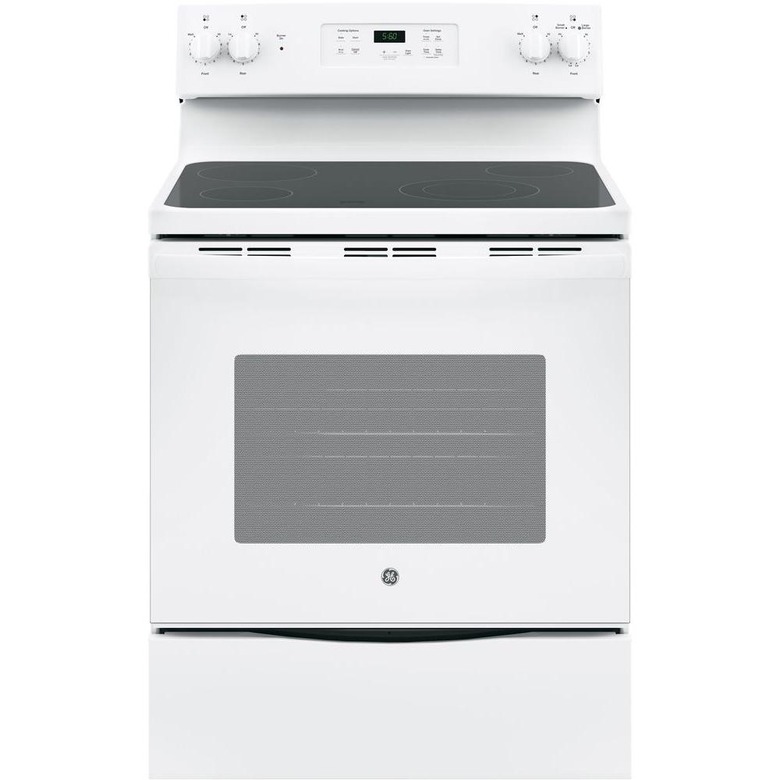 White glass top electric stove with storage drawer and display