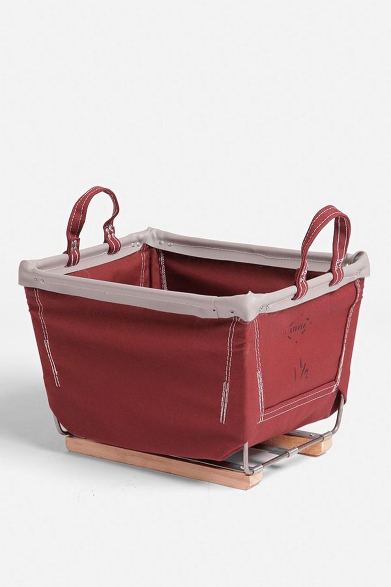 A red canvas storage bin on wooden sleds.