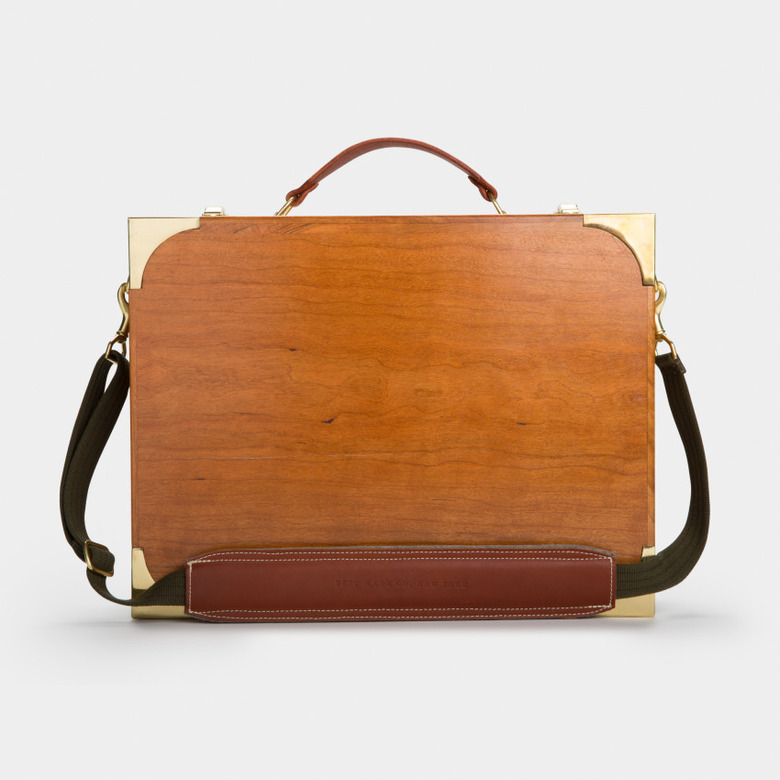 A briefcase-like wooden desk with a carry case.