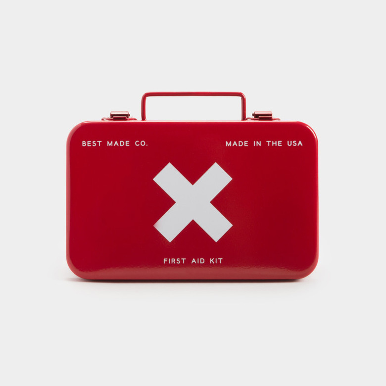 A red metal first aid kit with a white X on the front.
