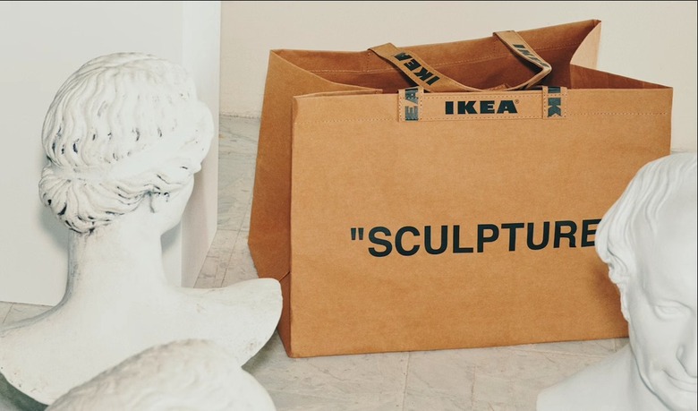 ikea bag with the phrase sculpture between two busts