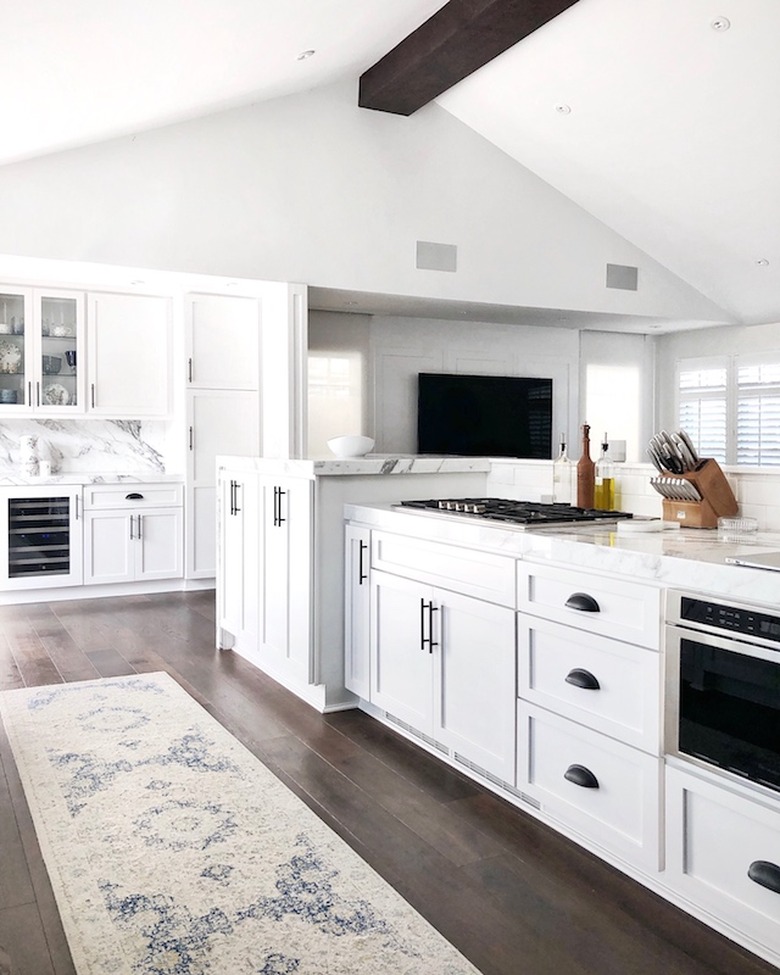 kitchen cabinet hardware idea in white kitchen with black cabinet pulls