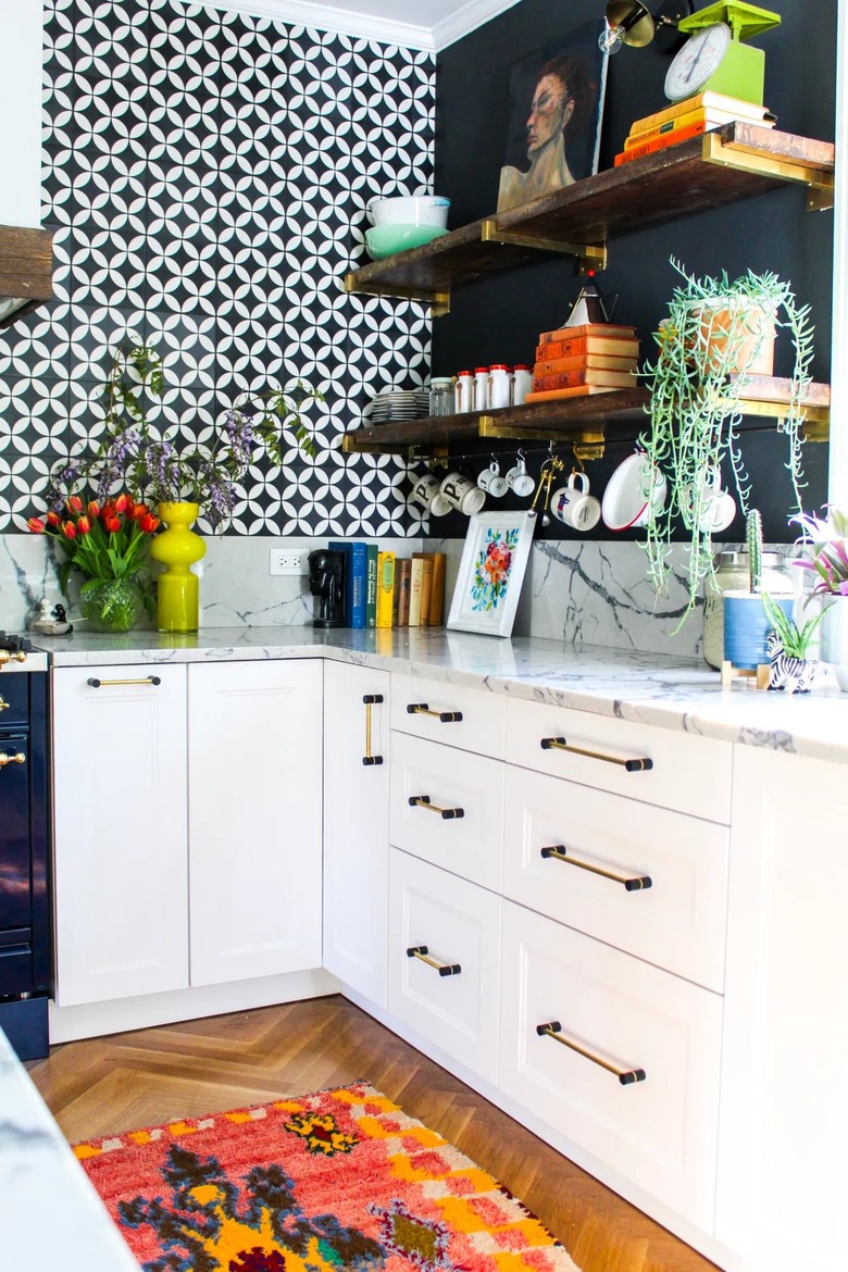 black and white kitchen with black and brass hardware