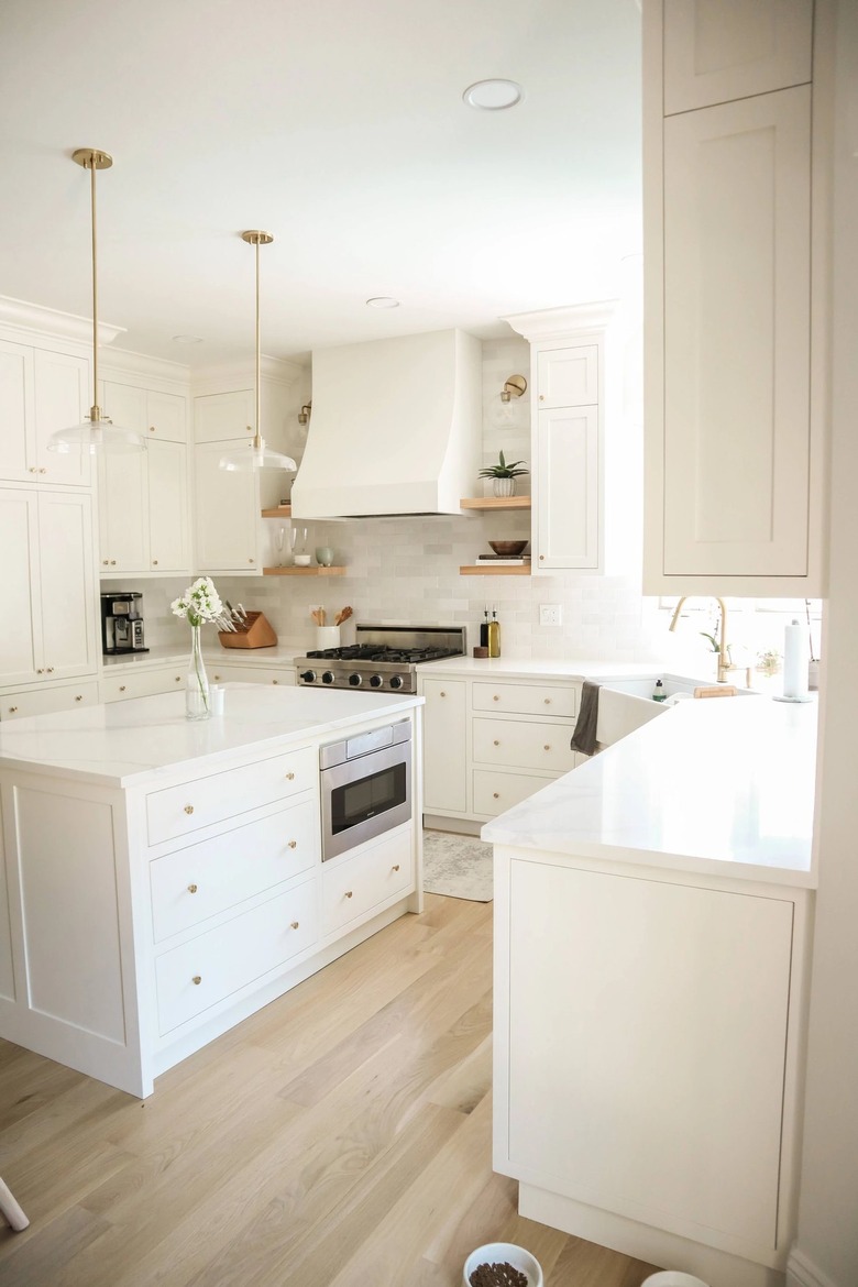 white kitchen with brass knobs