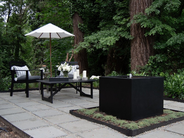 patio with pea gravel grout and square cement pavers