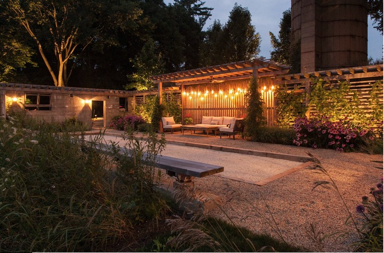 pea gravel patio with lounge area and bocce court