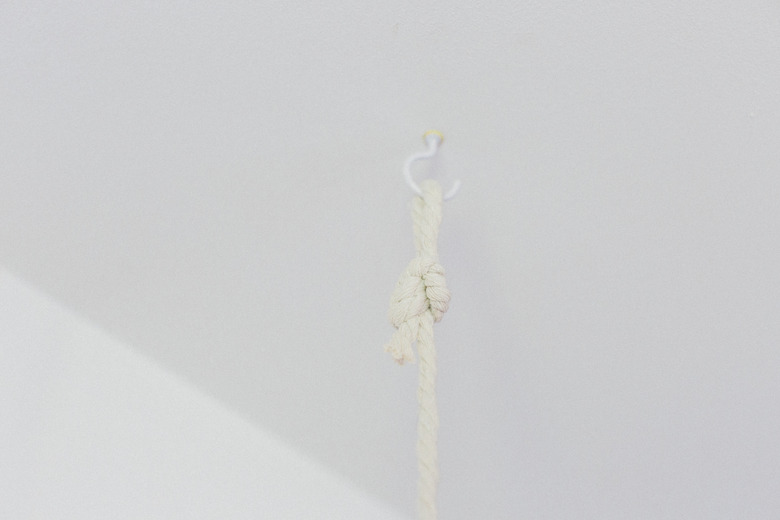 Install two hooks in the ceiling where you plan to hang the garden.