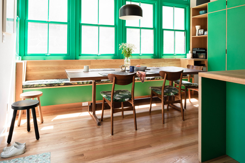 green kitchen with hardwood floors