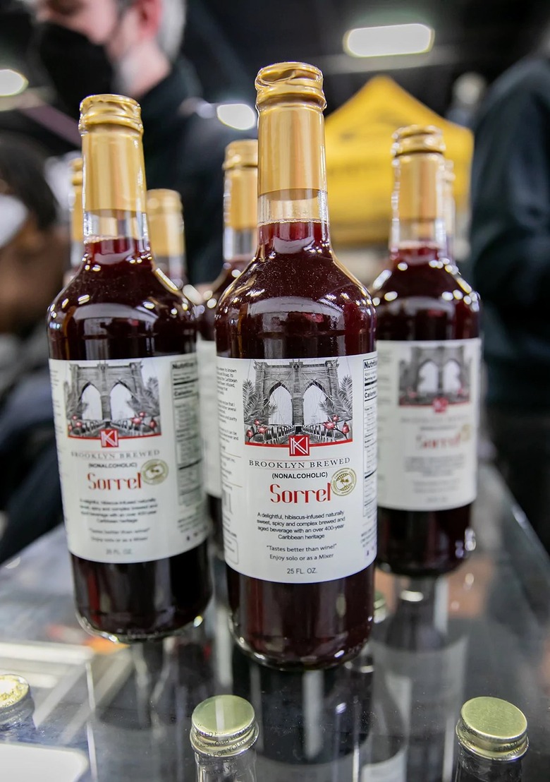 Bottles of Brooklyn Brewed Sorrel Non-Alcoholic Sorrel Mocktail on a glass shelf.