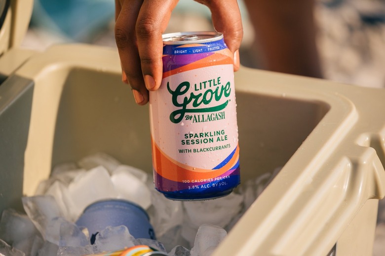 Allagash Little Grove Blackcurrant Sparkling Session Ale being taken out of a cooler filled with ice.